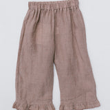 A pair of toddler's wide-leg linen pants in a dusty rose-brown color, featuring an elastic waistband and ruffled hems, laid flat against a light gray background.
